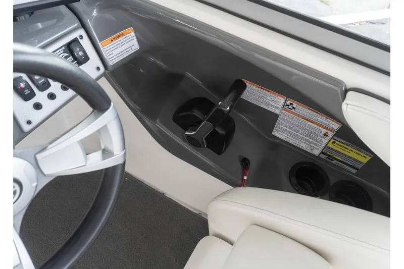 Slide: The Image of 2015 Yamaha Boats AR190 cockpit with steering wheel and control panel. - 8