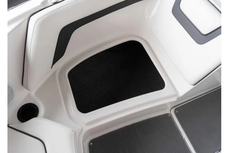 Slide: The Image of Interior storage compartment of 2015 Yamaha Boats AR190, featuring sleek white and black design. - 15