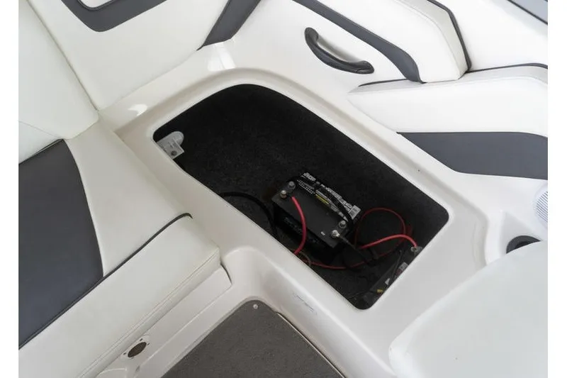 Slide: The Image of 2015 Yamaha AR190 boat battery compartment with wiring and seating area. - 20