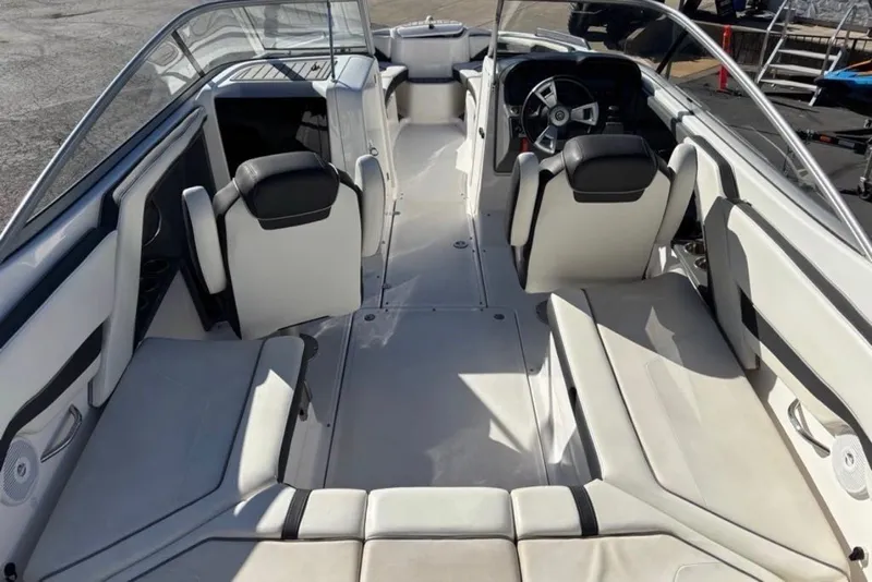 Slide: The Image of 2015 Yamaha Boats AR240 HO interior with white seating and steering wheel. - 5