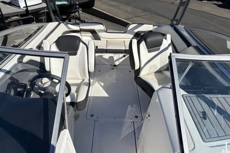 Slide: The Image of 2015 Yamaha Boats AR240 HO interior with sleek seating and steering wheel. - 8