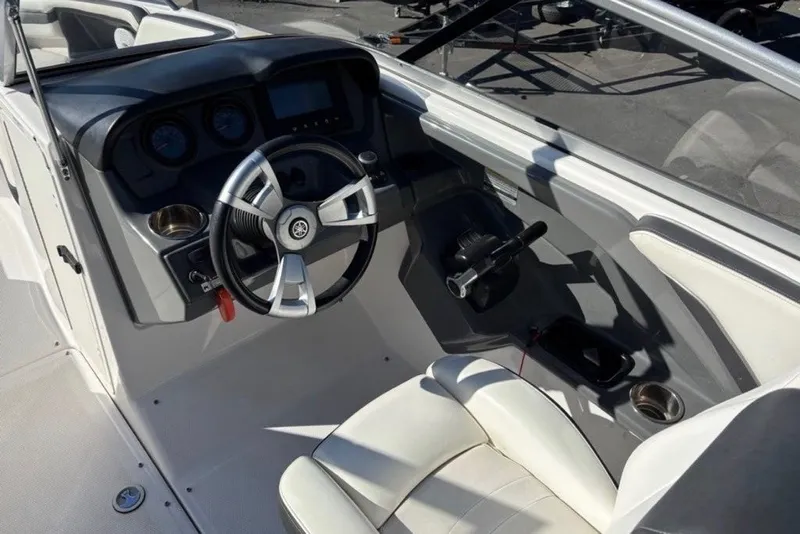 Slide: The Image of 2015 Yamaha Boats AR240 HO cockpit with steering wheel and controls. - 2