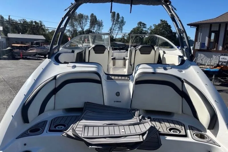 Slide: The Image of 2015 Yamaha Boats AR240 HO, sleek design, spacious seating, outdoor setting. - 6