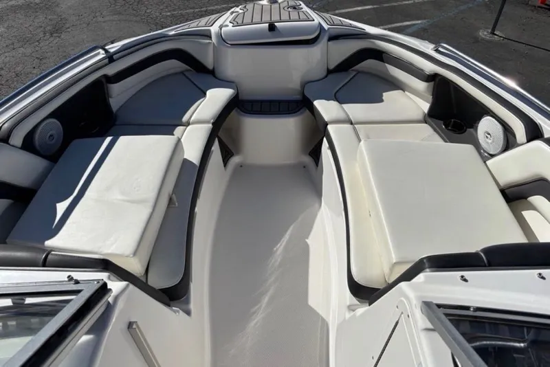 Slide: The Image of 2015 Yamaha Boats AR240 HO interior with spacious seating and sleek design. - 7