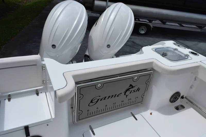 Slide: The Image of 2027 Sea Hunt Gamefish 25 boat with dual engines and fishing features. - 7
