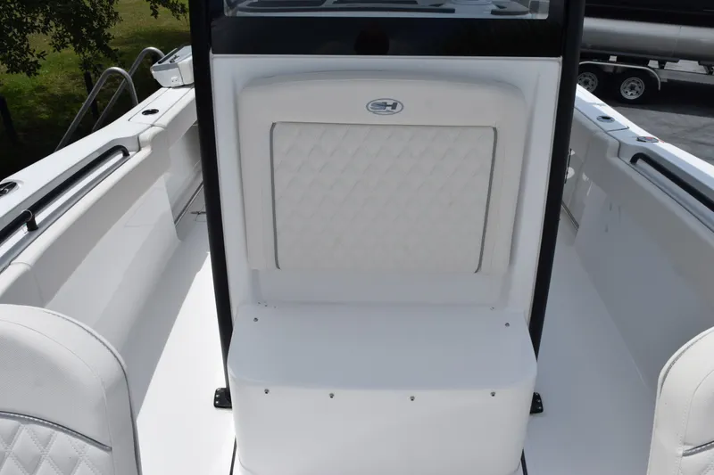 Slide: The Image of 2027 Sea Hunt Gamefish 25 boat interior with white cushioned seating and sleek design. - 9