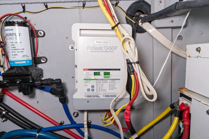 Slide: The Image of Electrical system in a 2006 Meridian 411 Sedan, featuring ProNautic charger and Shurflo pump. - 37