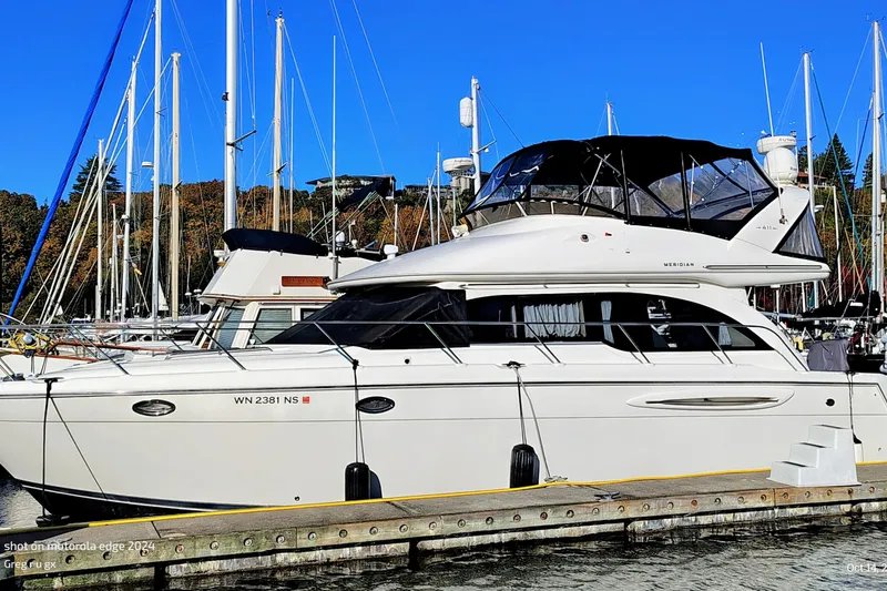 The Image of 2006 Meridian 411 Sedan yacht docked at marina with clear blue sky. - 0