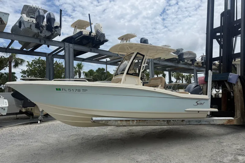 The Image of 2024 Scout 215 XSF boat on lift, showcasing sleek design and modern features. - 0