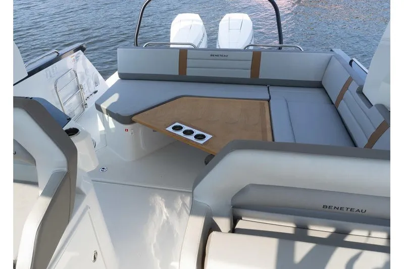 Slide: The Image of 2026 Beneteau Flyer 10 Sport Top boat interior with seating and table on water. - 27