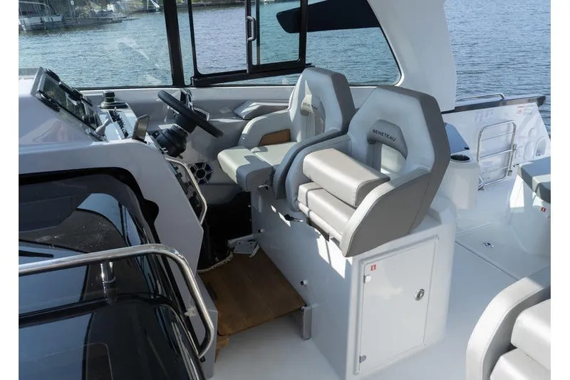 Slide: The Image of Interior of 2026 Beneteau Flyer 10 Sport Top, featuring modern helm and seating. - 26