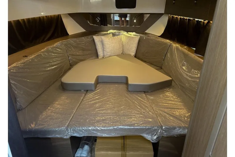 Slide: The Image of Interior cabin of 2026 Beneteau Flyer 10 Sport Top with cushioned seating. - 18