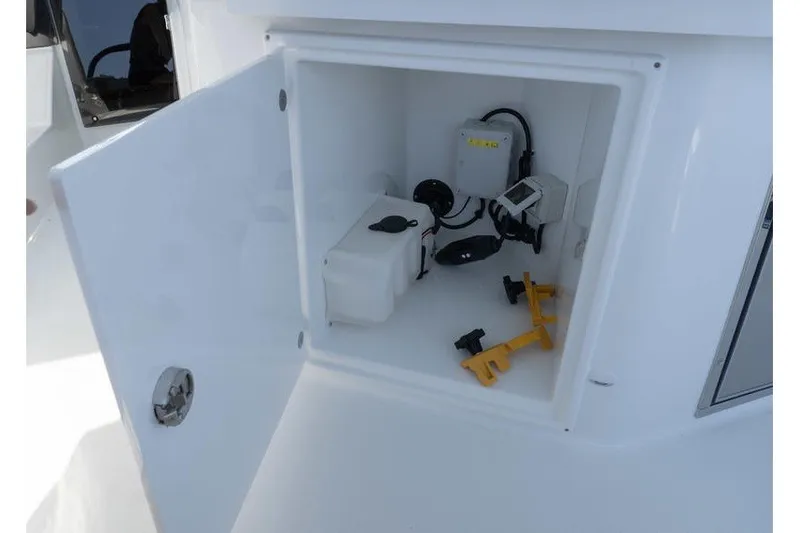 Slide: The Image of Open storage compartment on 2026 Beneteau Flyer 10 Sport Top boat. - 10