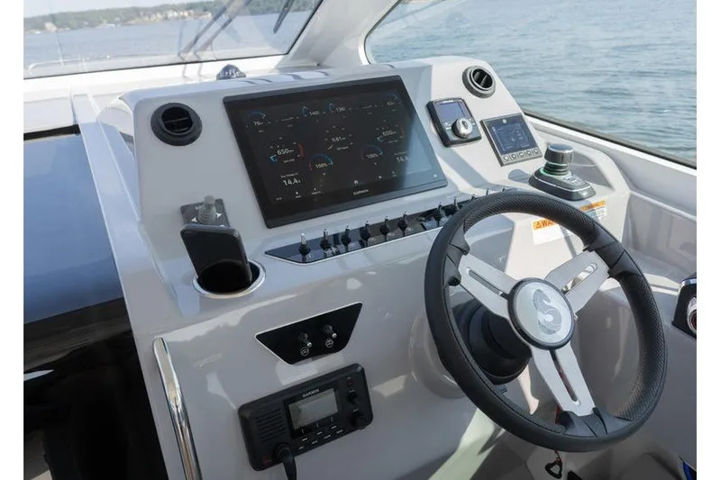 Slide: The Image of Helm of 2026 Beneteau Flyer 10 Sport Top with advanced navigation display. - 11