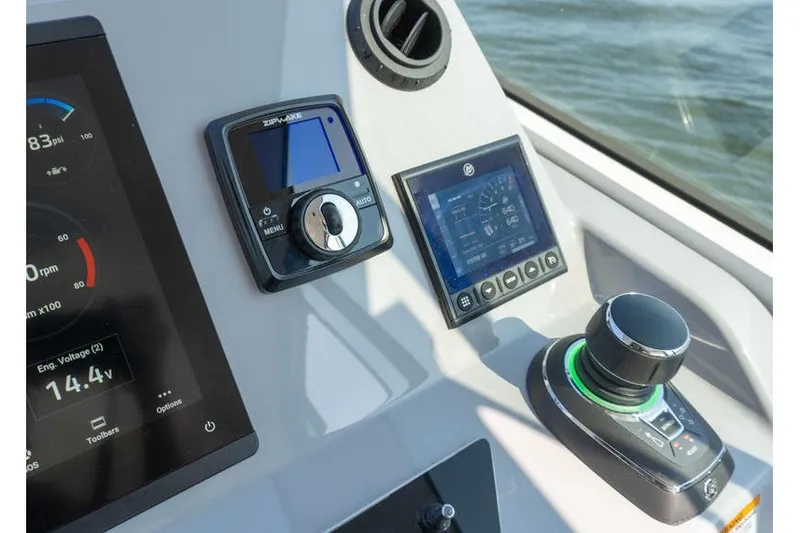 Slide: The Image of Control panel of 2026 Beneteau Flyer 10 Sport Top with advanced navigation displays. - 12