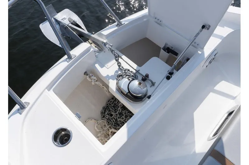 Slide: The Image of Anchor compartment of 2026 Beneteau Flyer 10 Sport Top with chain and winch. - 22