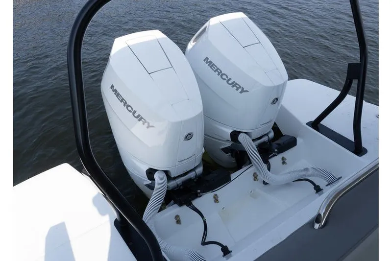 Slide: The Image of Twin Mercury outboard engines on a 2026 Beneteau Flyer 10 Sport Top boat. - 6