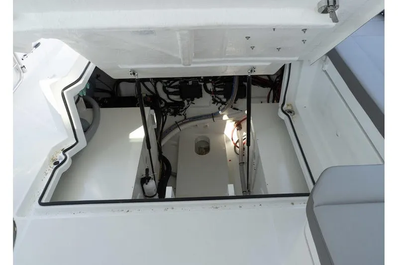Slide: The Image of Engine compartment of 2026 Beneteau Flyer 10 Sport Top, showcasing internal components and wiring. - 28