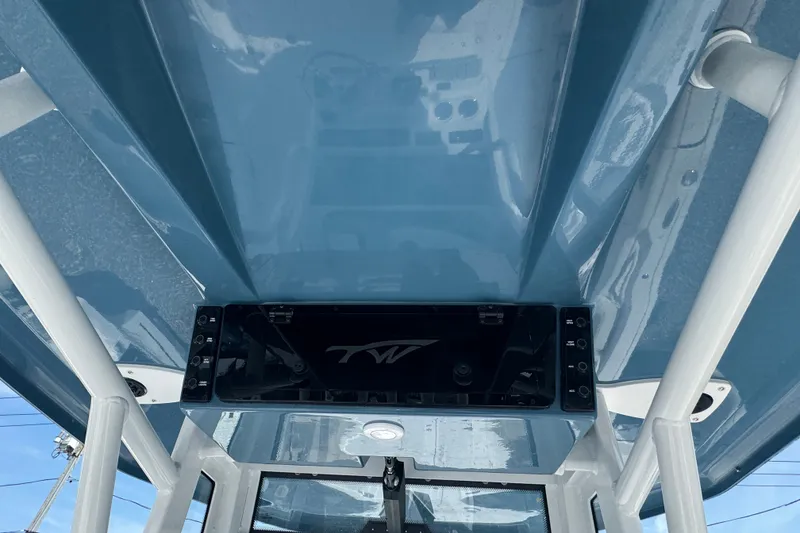 Slide: The Image of 2027 Tidewater 272 LXF boat interior, featuring sleek blue design and modern controls. - 17
