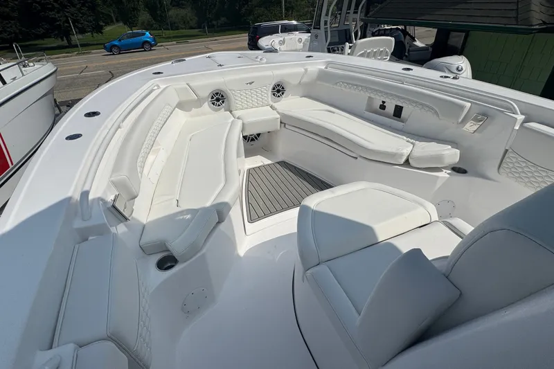 Slide: The Image of 2027 Tidewater 272 LXF boat interior with white seating and modern design. - 19