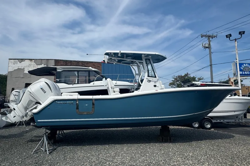 The Image of 2027 Tidewater 272 LXF boat with Yamaha engines displayed outdoors. - 1