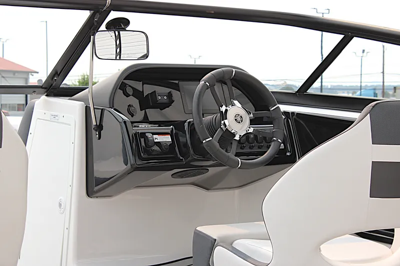 Slide: The Image of 2022 Yamaha Boats 195S dashboard with steering wheel and controls. - 13