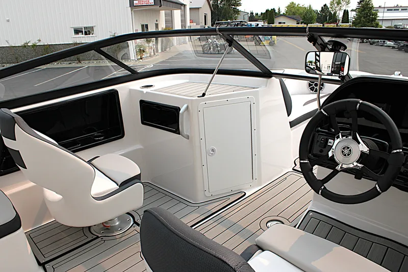 Slide: The Image of 2022 Yamaha Boats 195S interior with sleek design, modern steering, and comfortable seating. - 10