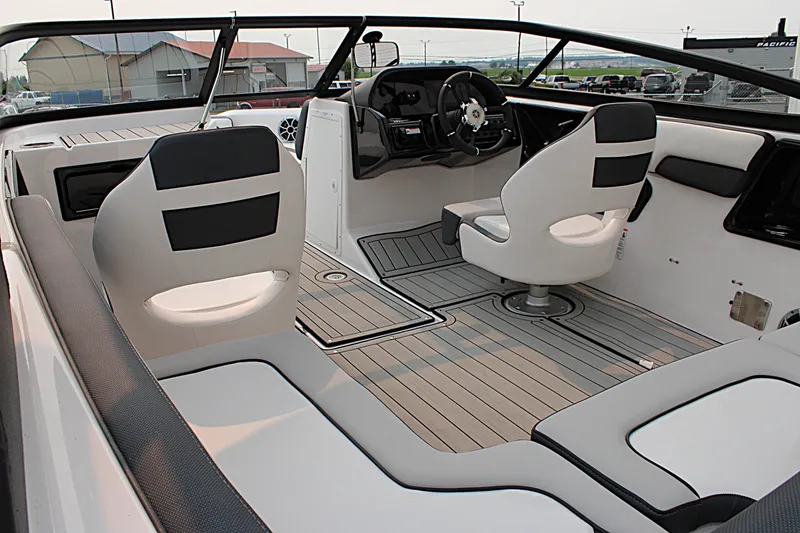 Slide: The Image of 2022 Yamaha Boats 195S interior with sleek seating and modern dashboard design. - 15