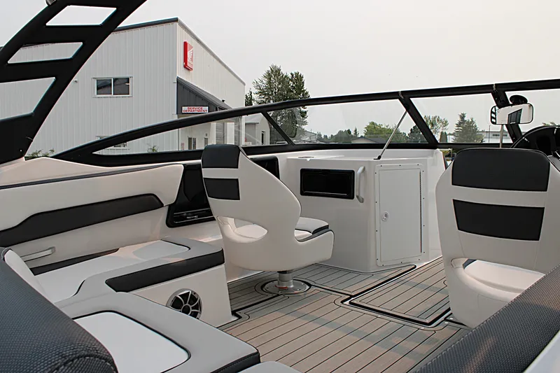 Slide: The Image of Interior of 2022 Yamaha Boats 195S, featuring sleek seating and modern design elements. - 12