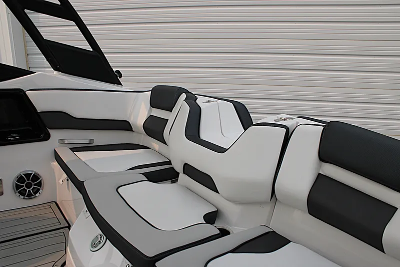 Slide: The Image of 2022 Yamaha Boats 195S interior seating with sleek black and white design. - 14