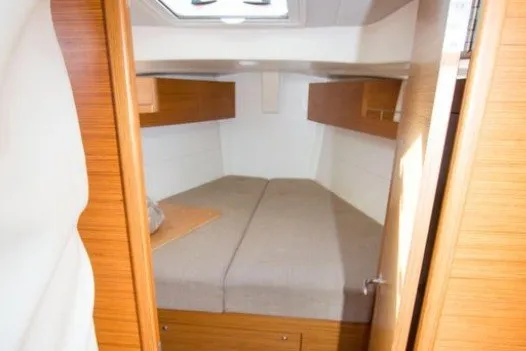 Slide: The Image of 2015 X-Yachts Xc 38 cabin interior with cozy bed and wooden finish. - 12