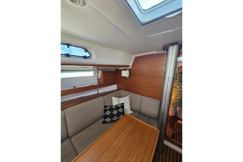 Slide: The Image of Interior of 2015 X-Yachts Xc 38 sailboat with cozy seating and wooden table. - 7