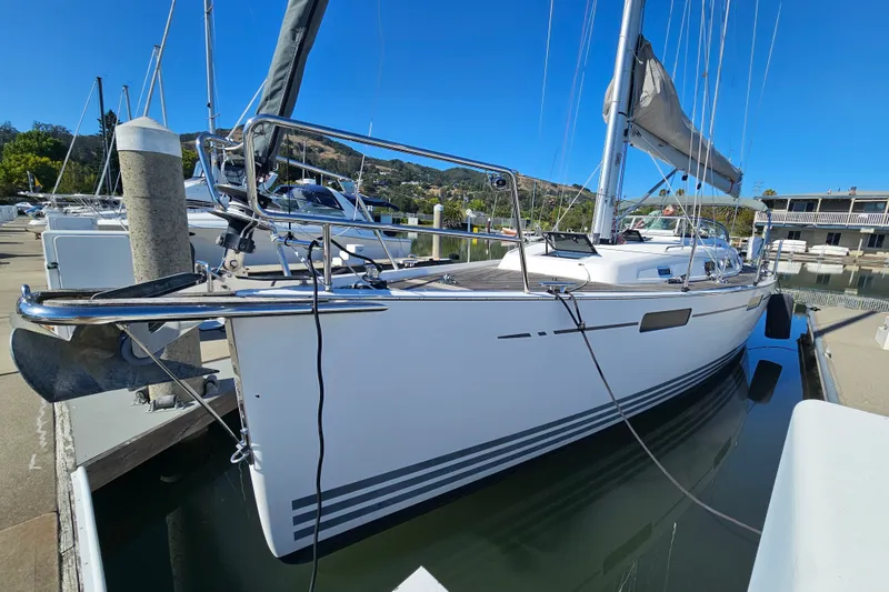 Slide: The Image of 2015 X-Yachts Xc 38 sailboat docked in a marina under clear blue skies. - 1