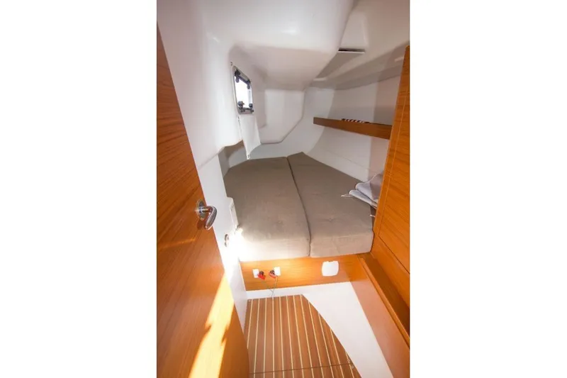 Slide: The Image of Cozy cabin interior of 2015 X-Yachts Xc 38 with wooden accents and comfortable bedding. - 11