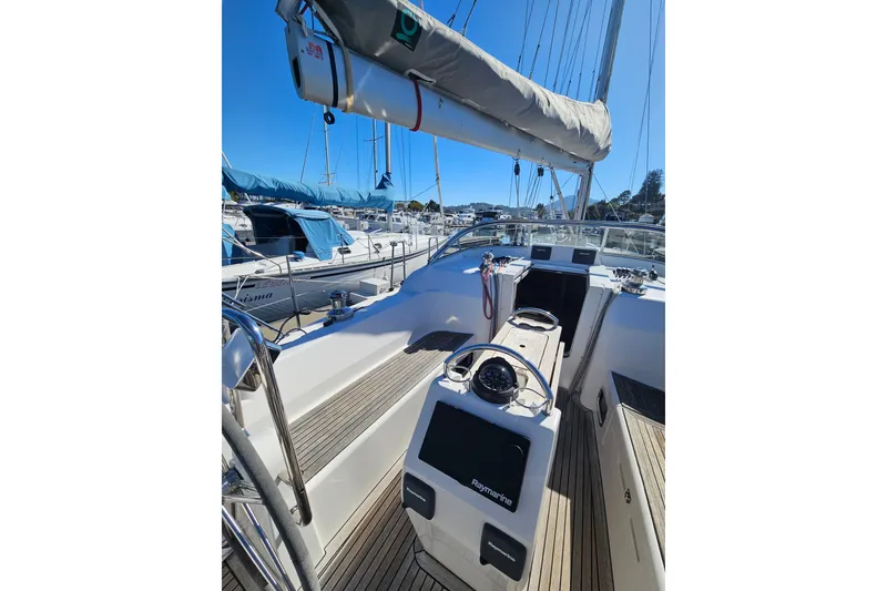Slide: The Image of 2015 X-Yachts Xc 38 sailboat cockpit with steering wheel and navigation equipment. - 3