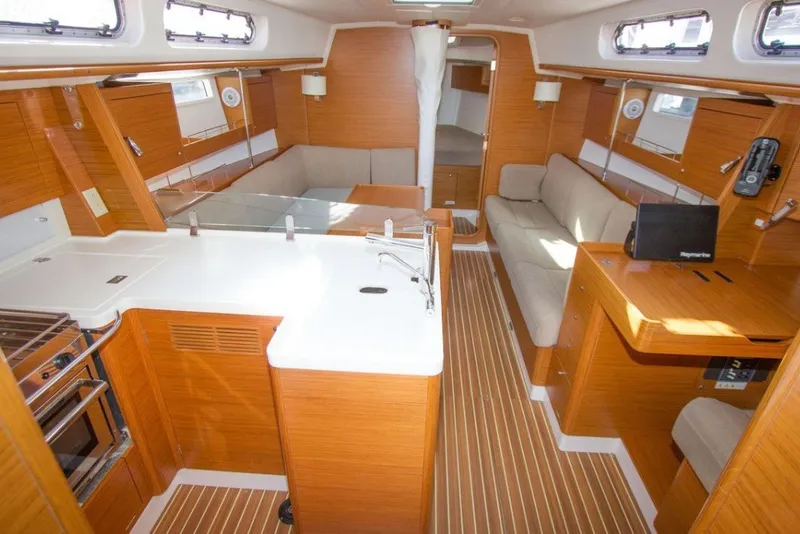 Slide: The Image of Interior of 2015 X-Yachts Xc 38 sailboat, featuring modern wood finish and spacious layout. - 5