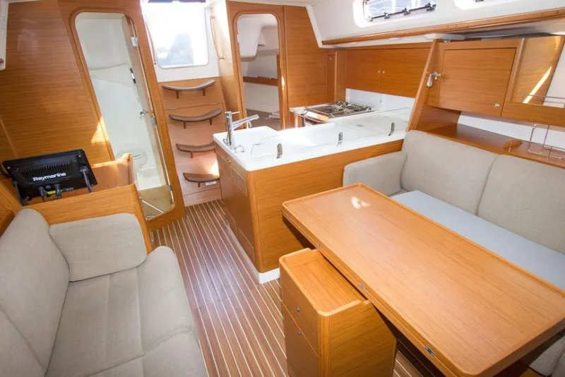 Slide: The Image of Interior of 2015 X-Yachts Xc 38, featuring wood finish and modern amenities. - 6