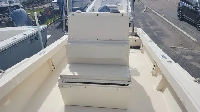 Slide: The Image of The image shows the deck of a 2004 Parker 23 Special Edition boat with a bench seat. - 3