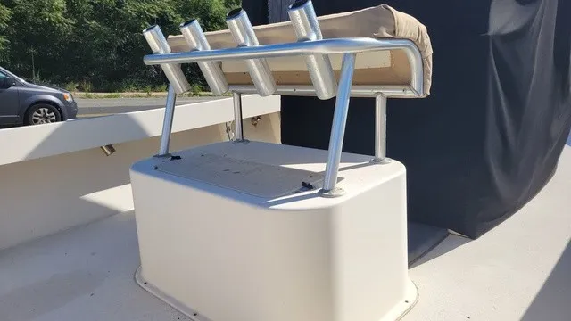 Slide: The Image of A rod holder on a 2004 Parker 23 Special Edition boat, featuring a cushioned seat. - 7