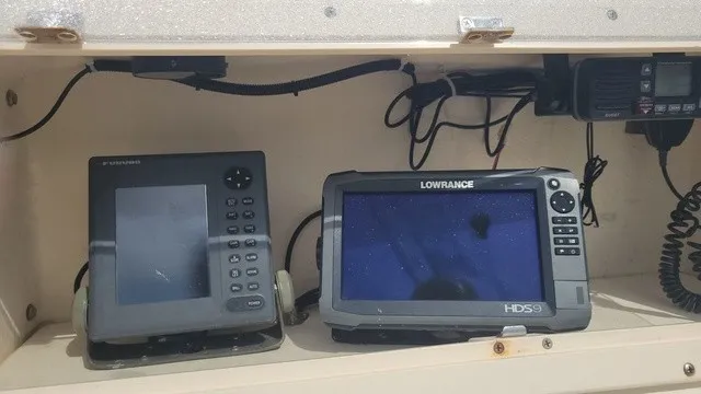 Slide: The Image of Electronic navigation devices mounted in a boat cabinet. - 6