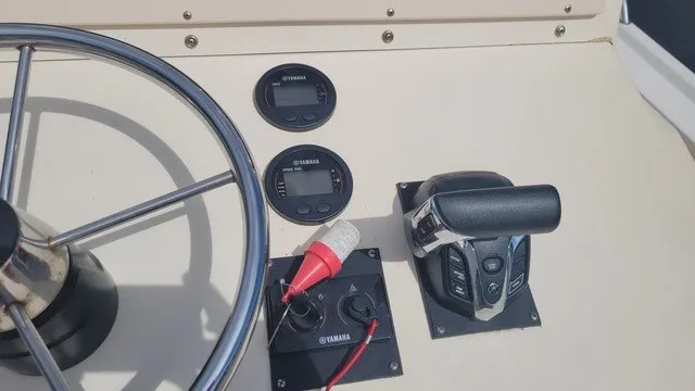 Slide: The Image of The image shows the helm of a 2004 Parker 23 Special Edition boat with Yamaha instruments. - 5