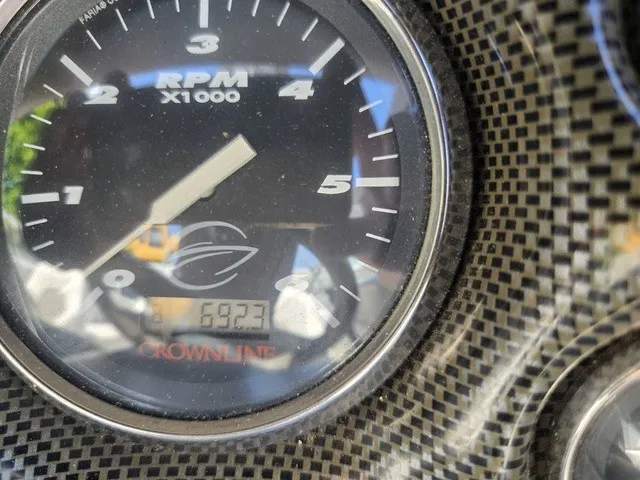 Slide: The Image of Close-up of a tachometer in a 2003 Crownline 230 BR boat. - 17