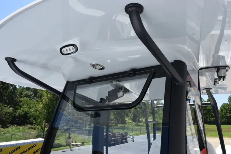 Slide: The Image of 2027 Sea Hunt Gamefish 30FS boat's T-top and windshield detail, showcasing sleek design. - 14