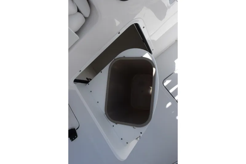 Slide: The Image of Open storage compartment on 2027 Sea Hunt Gamefish 30FS boat deck. - 17