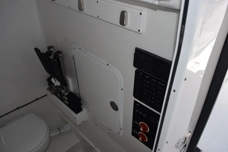 Slide: The Image of Interior of 2027 Sea Hunt Gamefish 30FS boat, featuring control panel and storage area. - 16