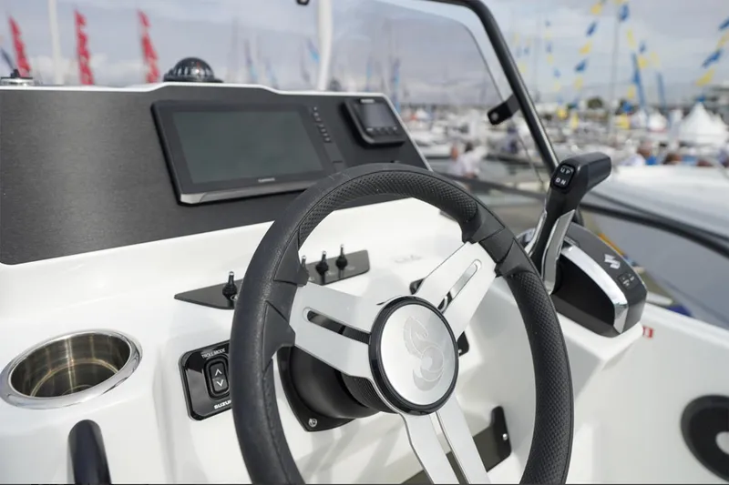 Slide: The Image of Manufacturer Provided Image: Steering console of 2026 Beneteau Flyer 7 SUNdeck with modern controls and display. - 3