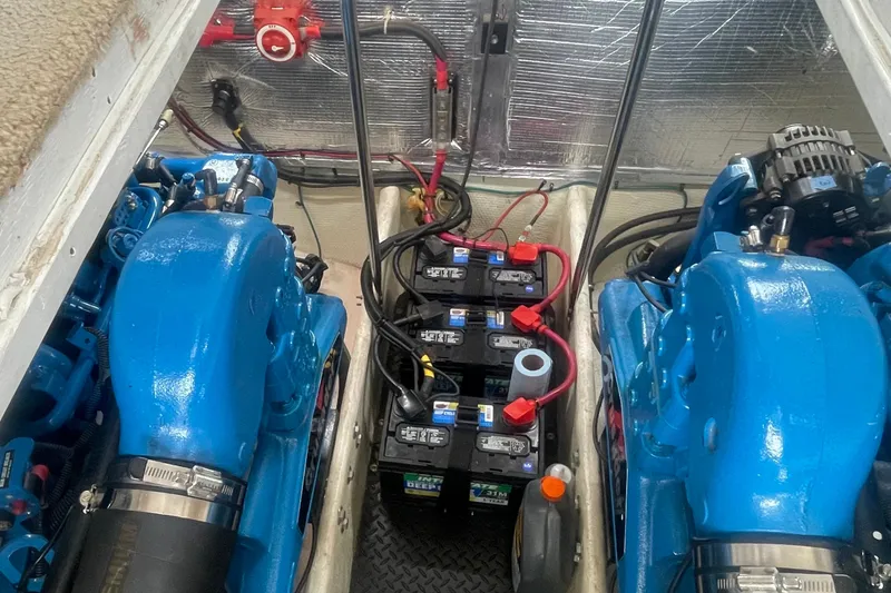 Slide: The Image of Engine room of 2006 Silverton 34 Convertible with blue engines and batteries. - 64