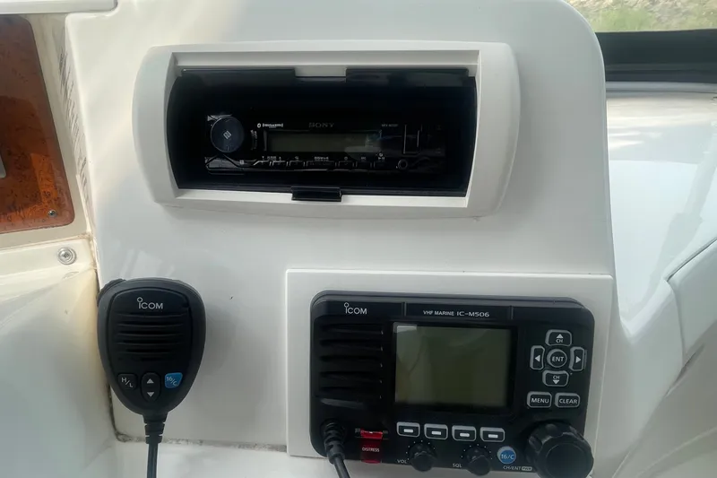 Slide: The Image of Control panel of a 2006 Silverton 34 Convertible with ICOM marine radio and Sony stereo. - 37