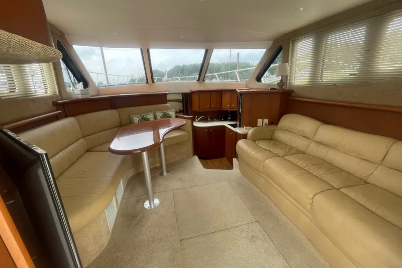 Slide: The Image of Luxurious interior of 2006 Silverton 34 Convertible yacht with plush seating and elegant wood finishes. - 41