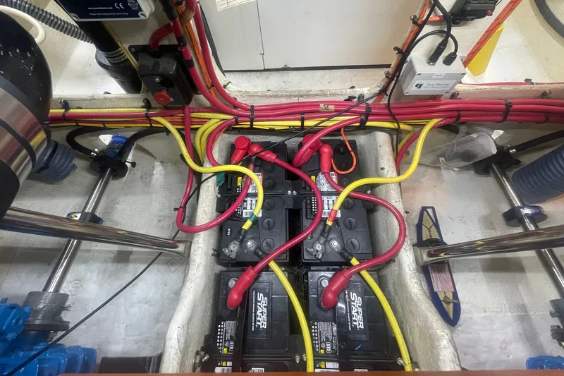 Slide: The Image of Engine compartment of 2006 Silverton 34 Convertible with batteries and wiring. - 63